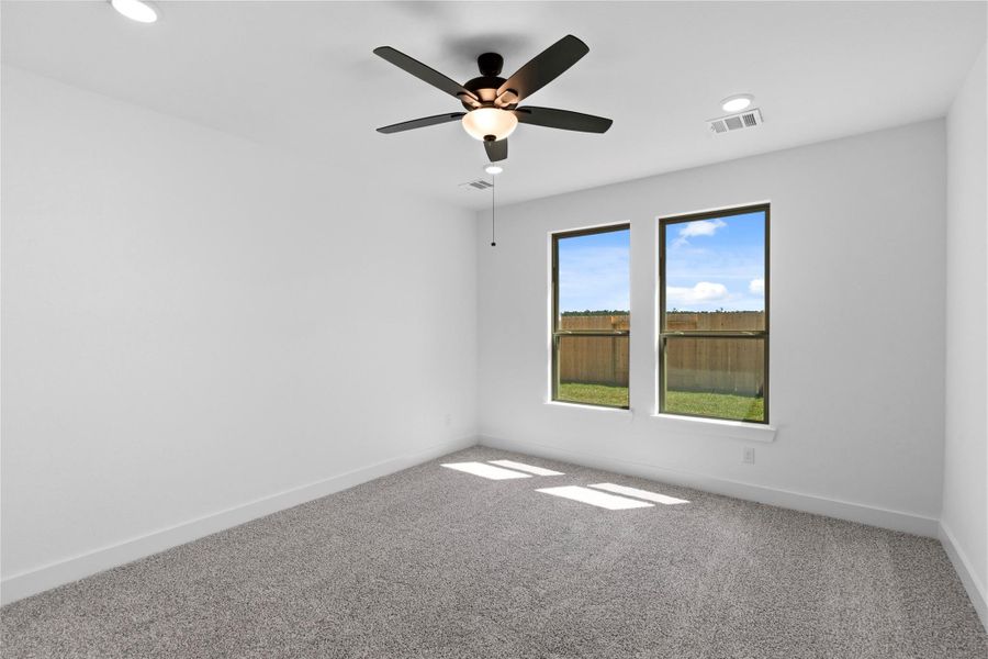 This Primary Bedroom offers Large, energy efficient windows invite natural light to fill the room, enhancing the airy, open feel while preserving privacy