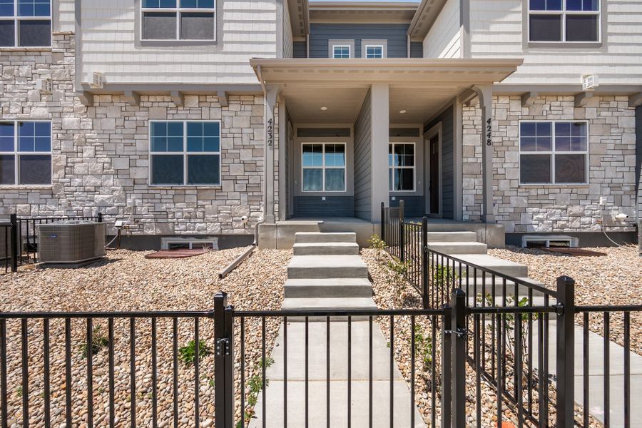 Exterior details and patio area of a home in The Lakes at Centerra, Loveland (Image 17).