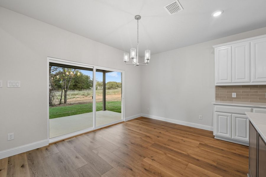 Representative unfurnished interior of a home built from the Garrison III by Cheldan Homes in Arbor Oaks, Boyd (Image 26).