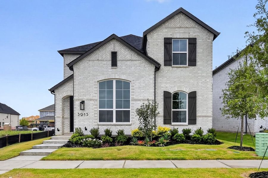 Front exterior of a new home in Mosaic, Celina, TX, highlighting curb appeal (Image 1). Front exterior of a new home in Mosaic, Celina, TX, highlighting curb appeal (Image 1).
