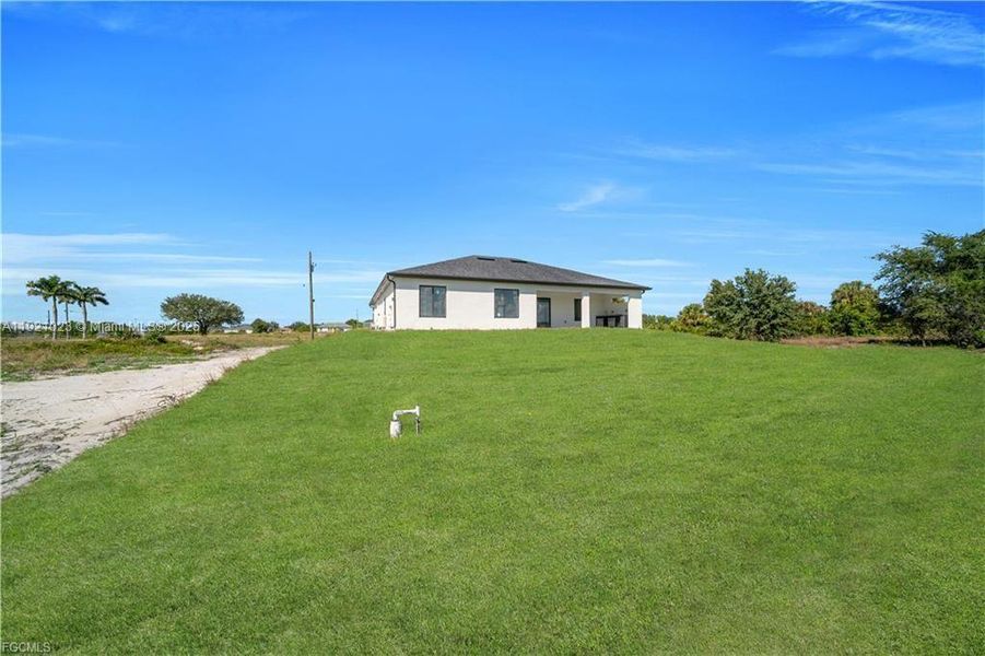 Exterior details and patio area of a home in , Lehigh Acres (Image 30). Exterior details and patio area of a home in , Lehigh Acres (Image 30).