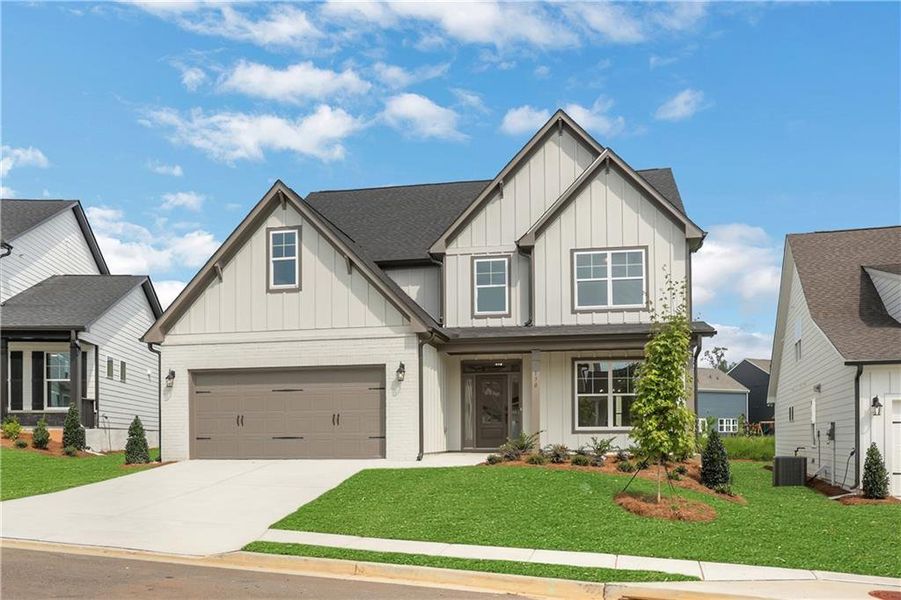 Front exterior of a new home in Twin Lakes, Hoschton, GA, highlighting curb appeal (Image 31).