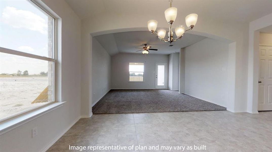 Expansive room featuring tile flooring, a contemporary chandelier, and an arched doorway opening to a carpeted area with a ceiling fan Expansive room featuring tile flooring, a contemporary chandelier, and an arched doorway opening to a carpeted area with a ceiling fan