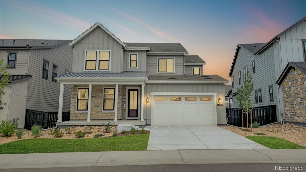 Front exterior of a new home in Stargaze at Solstice, Littleton, CO, highlighting curb appeal (Image 1).