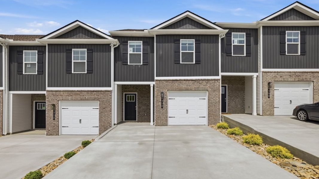 Front exterior of a new home in Macon Townhomes, Seymour, TN, highlighting curb appeal (Image 1). Front exterior of a new home in Macon Townhomes, Seymour, TN, highlighting curb appeal (Image 1).