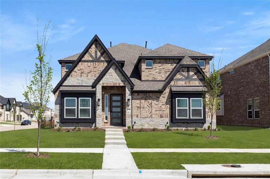 Front exterior of a new home in Villages of Creekwood, Frisco, TX, highlighting curb appeal (Image 1). Front exterior of a new home in Villages of Creekwood, Frisco, TX, highlighting curb appeal (Image 1).