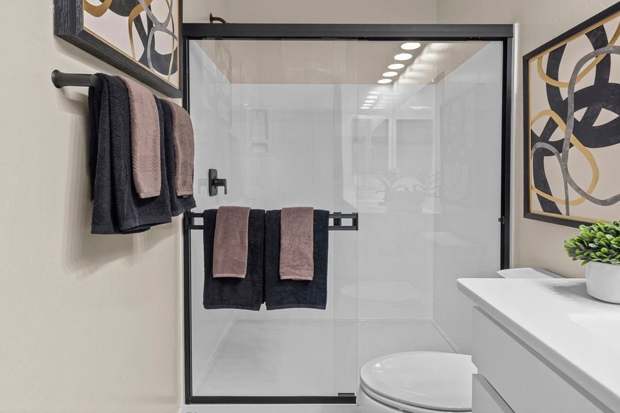 Optional walk-in shower with cultured marble surround at primary bath