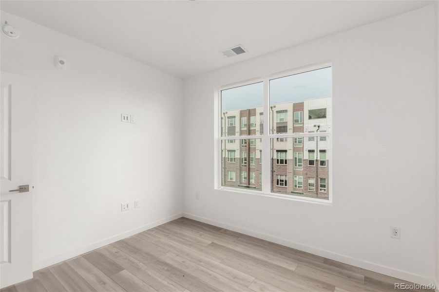 Spacious, unfurnished interior of a new home in The Scene at Sloan's Lake, Denver (Image 11).