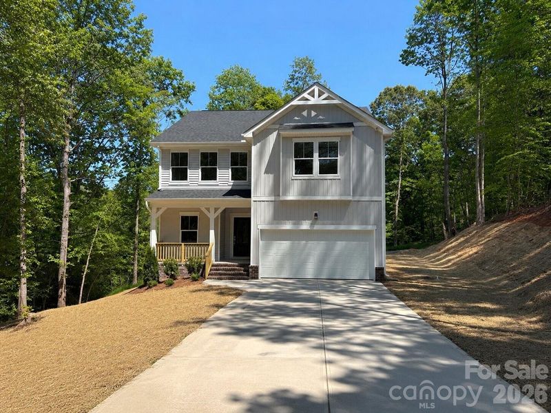 Front exterior of a new home in , Statesville, NC, highlighting curb appeal (Image 11).