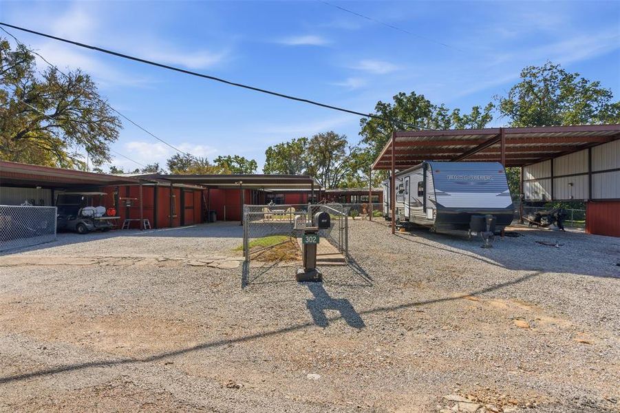 4 car carport and covered RV parking w/ 50 amp and water