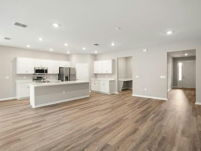 Enjoy a bright, open living area with low-maintenance LVP flooring.