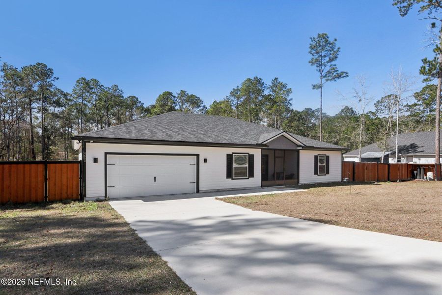 Front exterior of a new home in , Middleburg, FL, highlighting curb appeal (Image 2). Front exterior of a new home in , Middleburg, FL, highlighting curb appeal (Image 2).