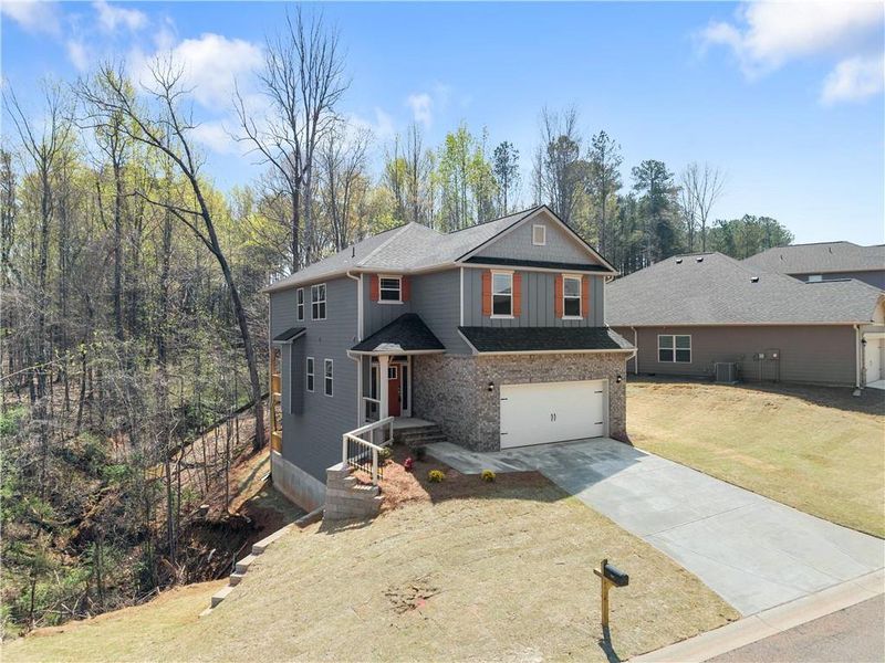 Front exterior of a new home in Magnolia Villas, Cornelia, GA, highlighting curb appeal (Image 23).