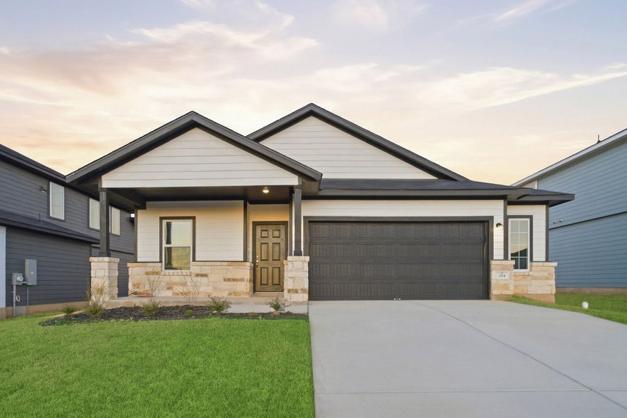 Front exterior of a new home in Hunters Glen, Jarrell, TX, highlighting curb appeal (Image 1). Front exterior of a new home in Hunters Glen, Jarrell, TX, highlighting curb appeal (Image 1).
