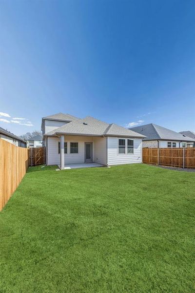 Covered Patio in the Willow home plan by Trophy Signature Homes – REPRESENTATIVE PHOTO