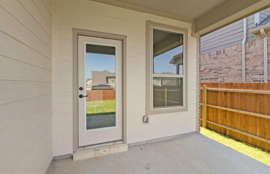 Exterior details and patio area of a home in Saddleback at Santa Rita Ranch, Liberty Hill (Image 21).