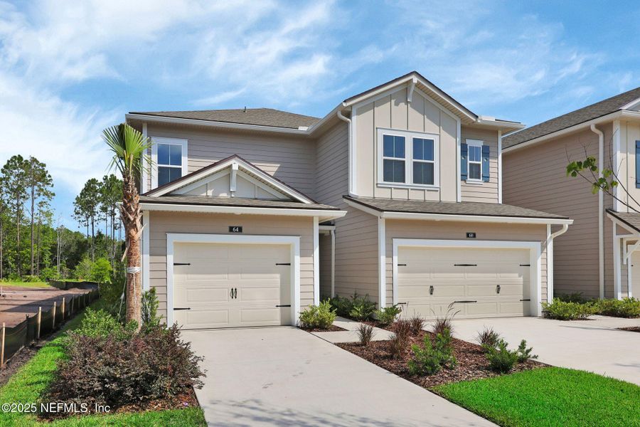 Front exterior of a new home in Woodland Park, Ponte Vedra, FL, highlighting curb appeal (Image 23).