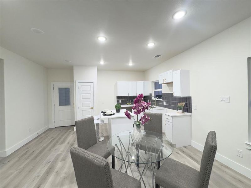 Dining area featuring light hardwood / wood-style flooring