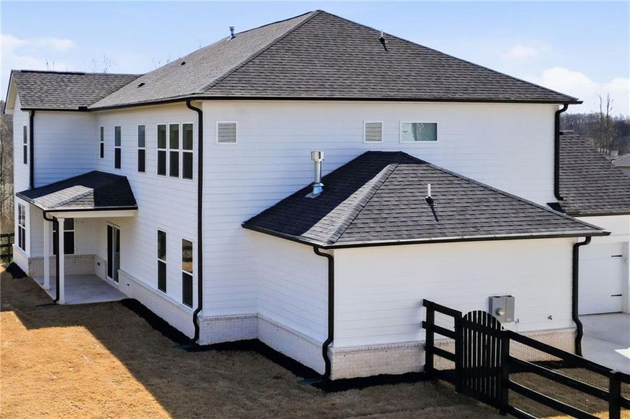 Exterior details and patio area of a home in Carmichael Farms, Canton (Image 26).