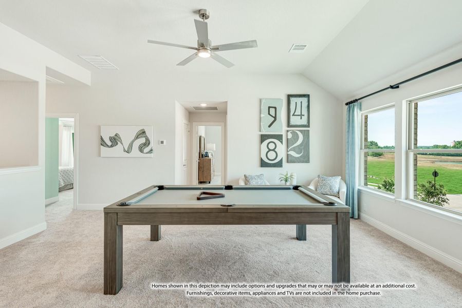 Game room with pool table, vaulted ceiling, ceiling fan, and large windows overlooking a yard Game room with pool table, vaulted ceiling, ceiling fan, and large windows overlooking a yard