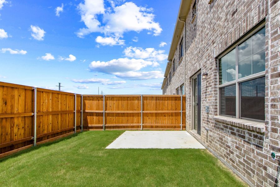 Exterior details and patio area of a home in Wildridge, Oak Point (Image 25).