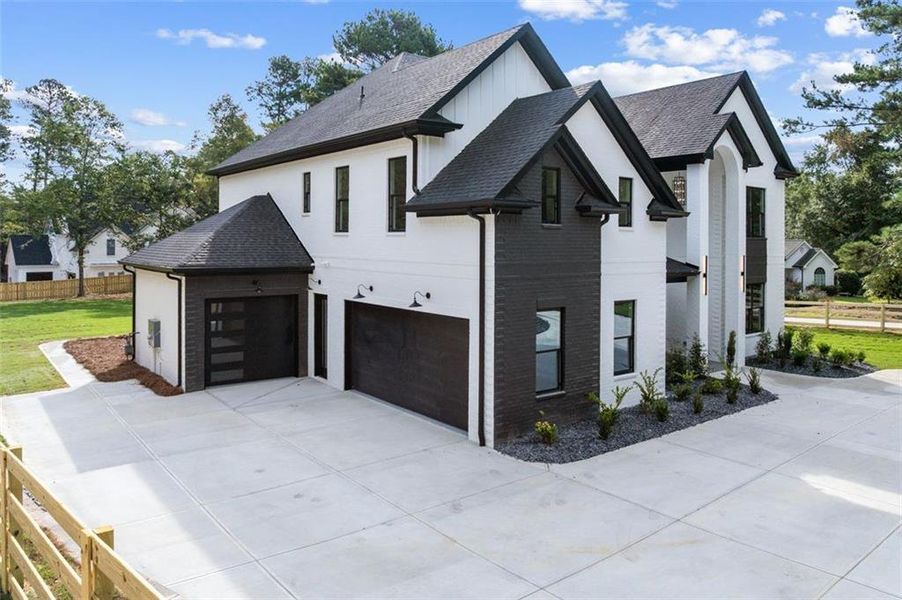Front exterior of a new home in , Lawrenceville, GA, highlighting curb appeal (Image 1). Front exterior of a new home in , Lawrenceville, GA, highlighting curb appeal (Image 1).
