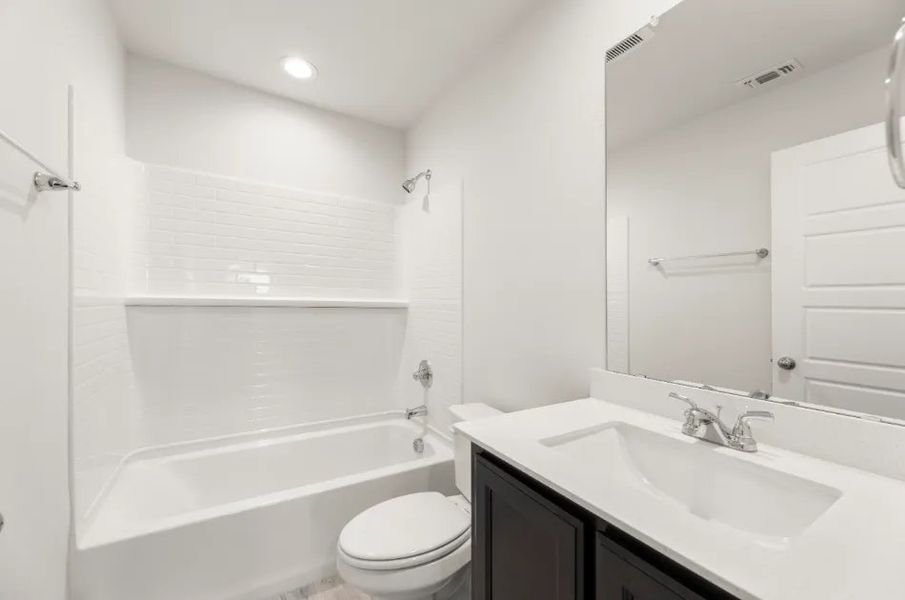 Front exterior of a new home in Heartland, Heartland, TX, highlighting curb appeal (Image 18). Front exterior of a new home in Heartland, Heartland, TX, highlighting curb appeal (Image 18).