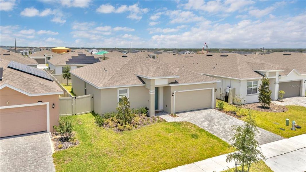 Front exterior of a new home in Tarpon Bay, Haines City, FL, highlighting curb appeal (Image 1). Front exterior of a new home in Tarpon Bay, Haines City, FL, highlighting curb appeal (Image 1).