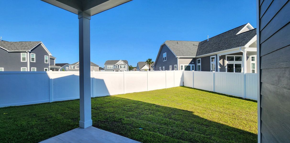 Exterior details and patio area of a home in Waterbridge, Myrtle Beach (Image 3).