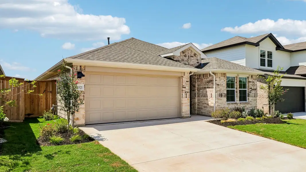 Front exterior of a new home in Briarwood, Elgin, TX, highlighting curb appeal (Image 2).