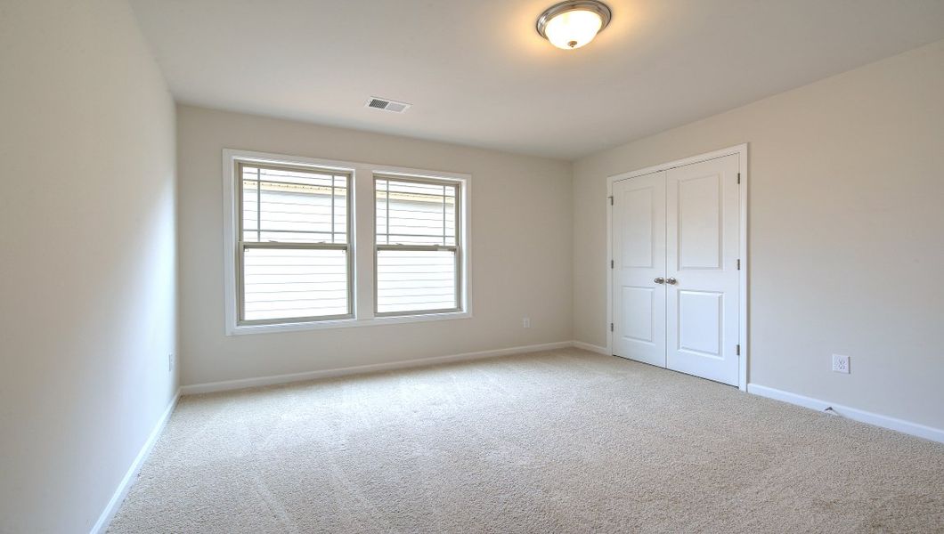 Spacious, unfurnished interior of a new home in Reserve at Tap Root Farms, Fletcher (Image 37).