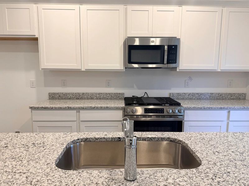 Kitchen - Chic white finishes and smooth surfaces shine. Kitchen - Chic white finishes and smooth surfaces shine.