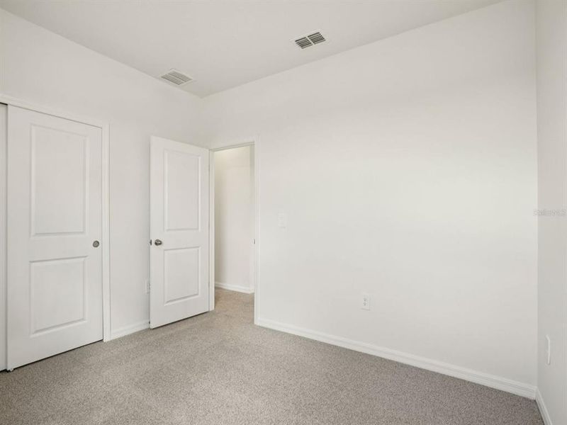 Spacious, unfurnished interior of a new home in Coasterra - Reserve Series, Palmetto (Image 40).