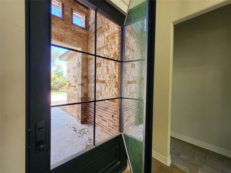 Detailed view of baseboards and wood finished floors