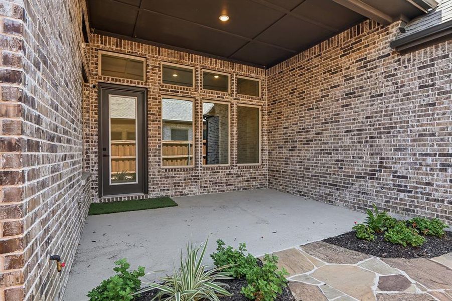 Exterior details and patio area of a home in Elements at Viridian - Garden Series, Arlington (Image 21). Exterior details and patio area of a home in Elements at Viridian - Garden Series, Arlington (Image 21).