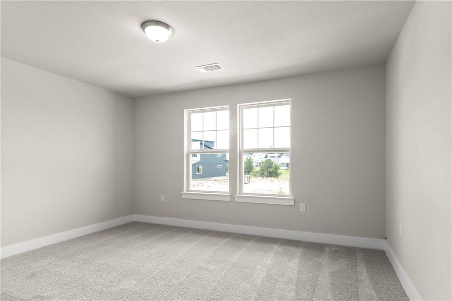 Empty room featuring light carpet and baseboards Empty room featuring light carpet and baseboards