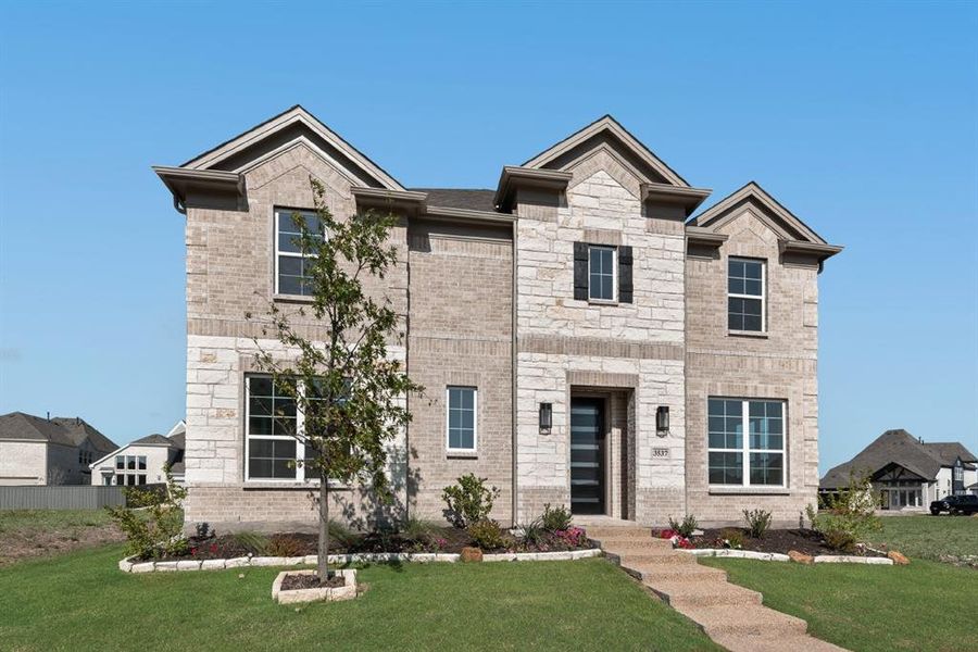 Front exterior of a new home in Prairie Ridge, Venus, TX, highlighting curb appeal (Image 1). Front exterior of a new home in Prairie Ridge, Venus, TX, highlighting curb appeal (Image 1).