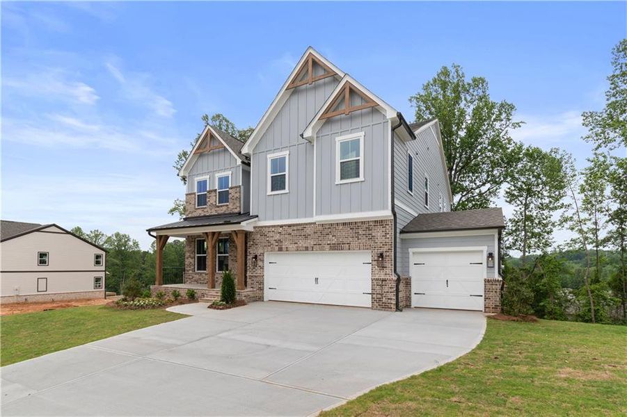 Front exterior of a new home in Tiberon Woods, Cumming, GA, highlighting curb appeal (Image 2).