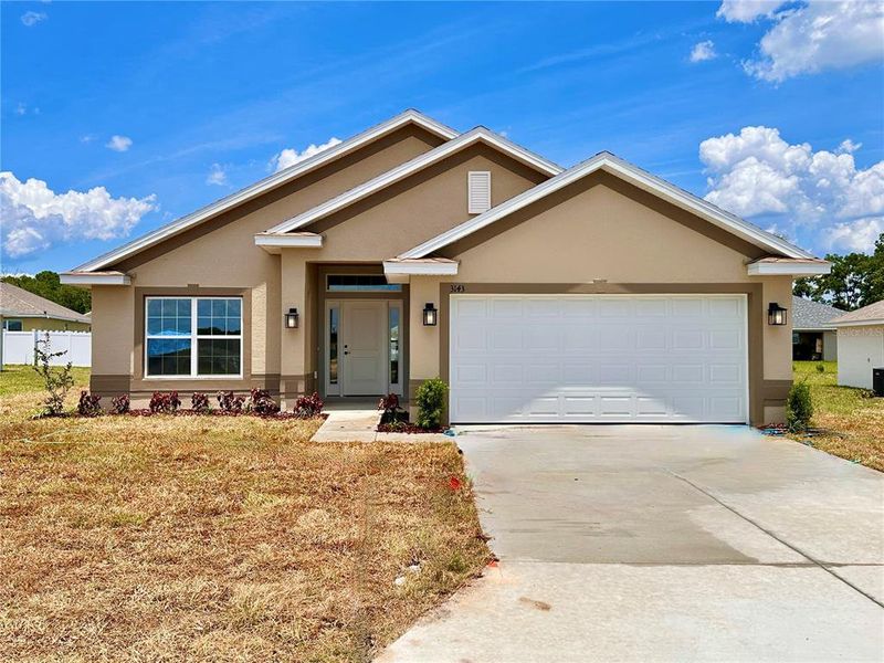 Front exterior of a new home in , Ocala, FL, highlighting curb appeal (Image 1). Front exterior of a new home in , Ocala, FL, highlighting curb appeal (Image 1).