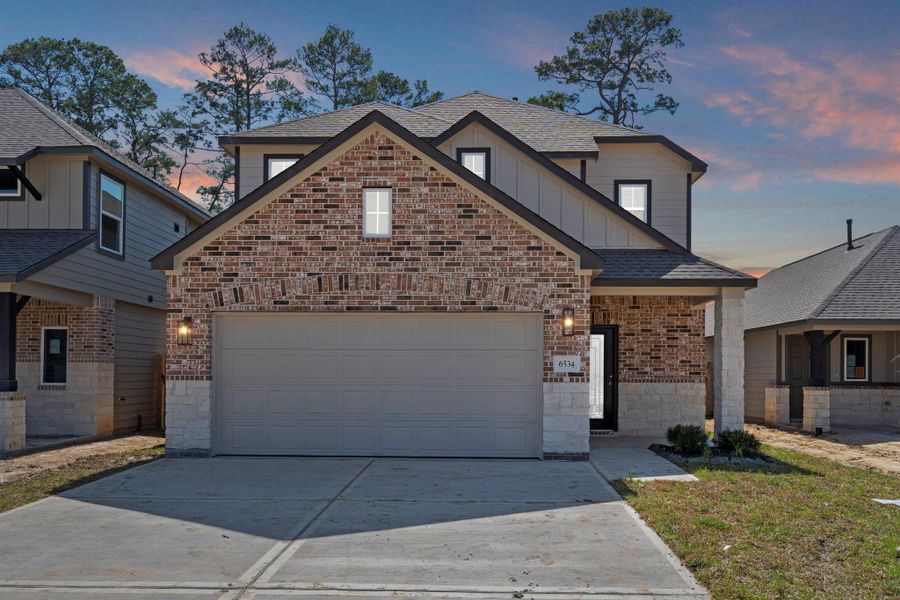 Front exterior of a new home in Cypresswood Landing, Humble, TX, highlighting curb appeal (Image 20).