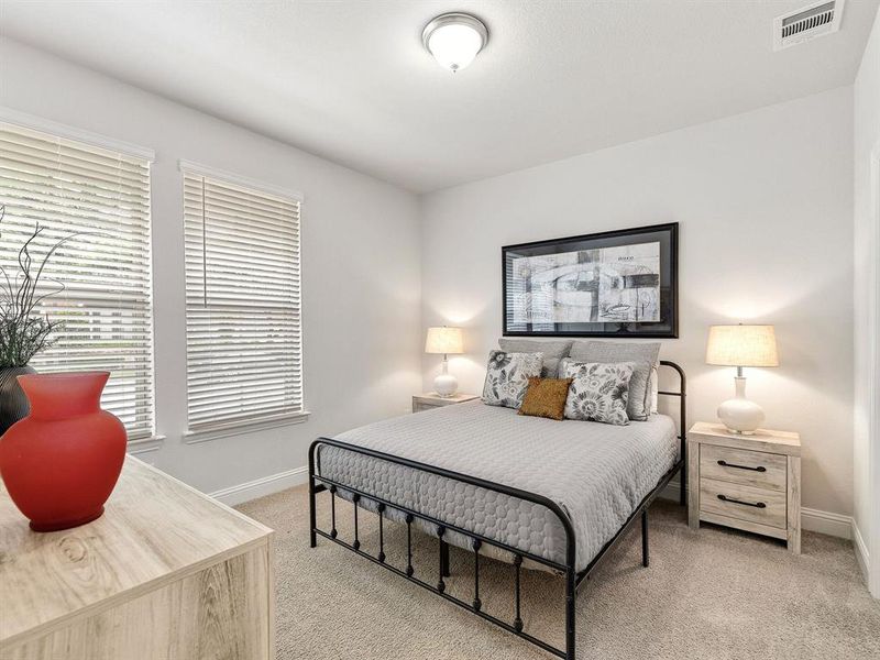 The spacious ground-floor bedroom enjoys great natural light, creating a private retreat for guests, roommates, or family.