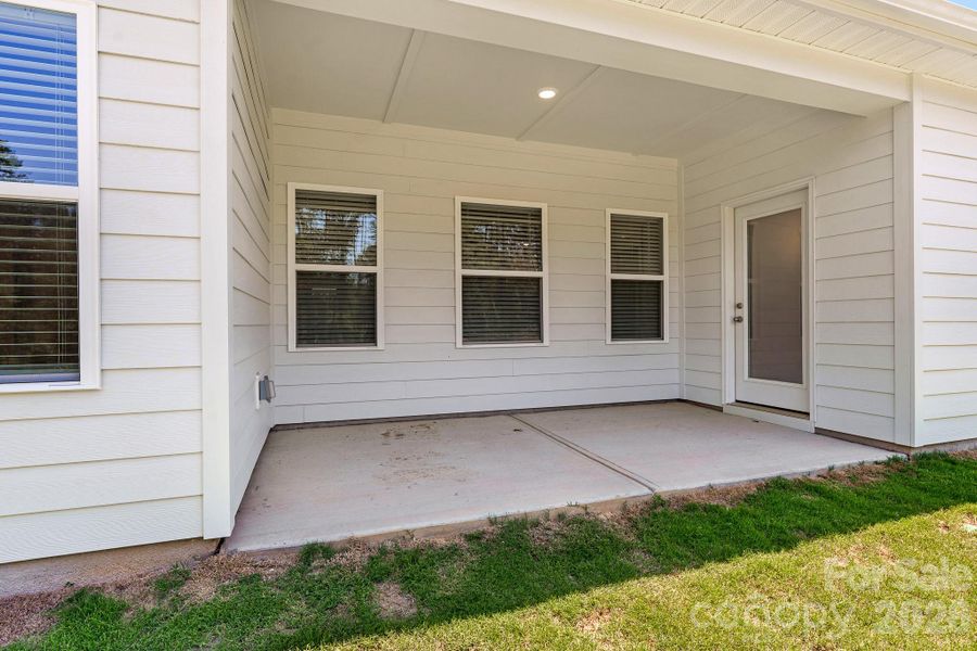 Exterior details and patio area of a home in Cottages at Indian Trail West, Indian Trail (Image 18).