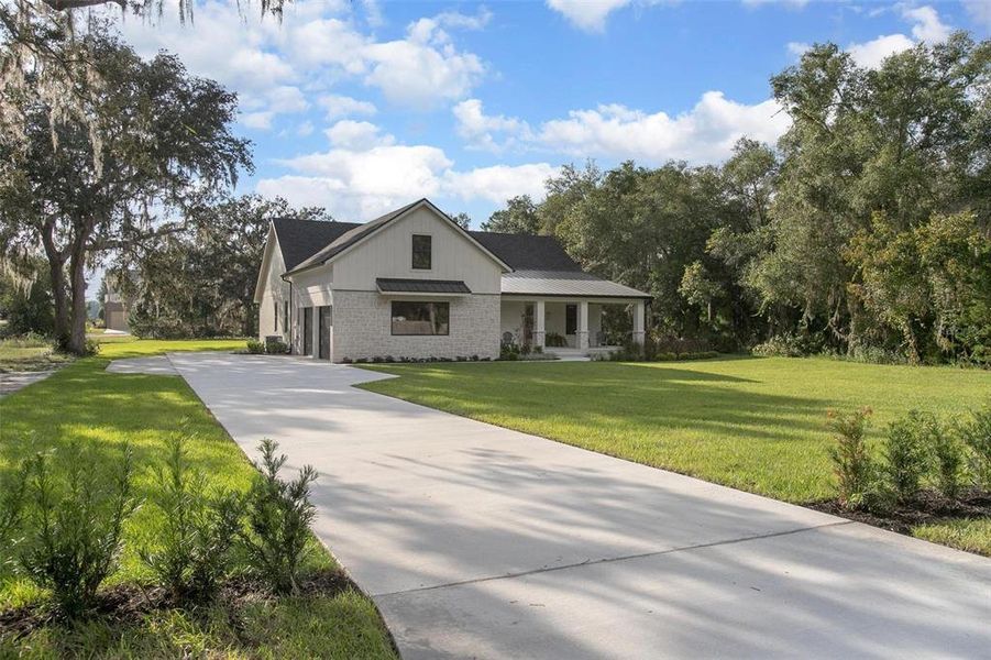 Front exterior of a new home in , Deland, FL, highlighting curb appeal (Image 29).