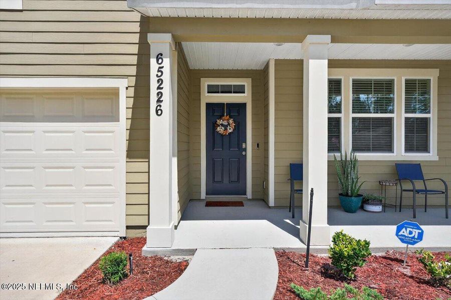 Front exterior of a new home in River Glen Express, Yulee, FL, highlighting curb appeal (Image 28).