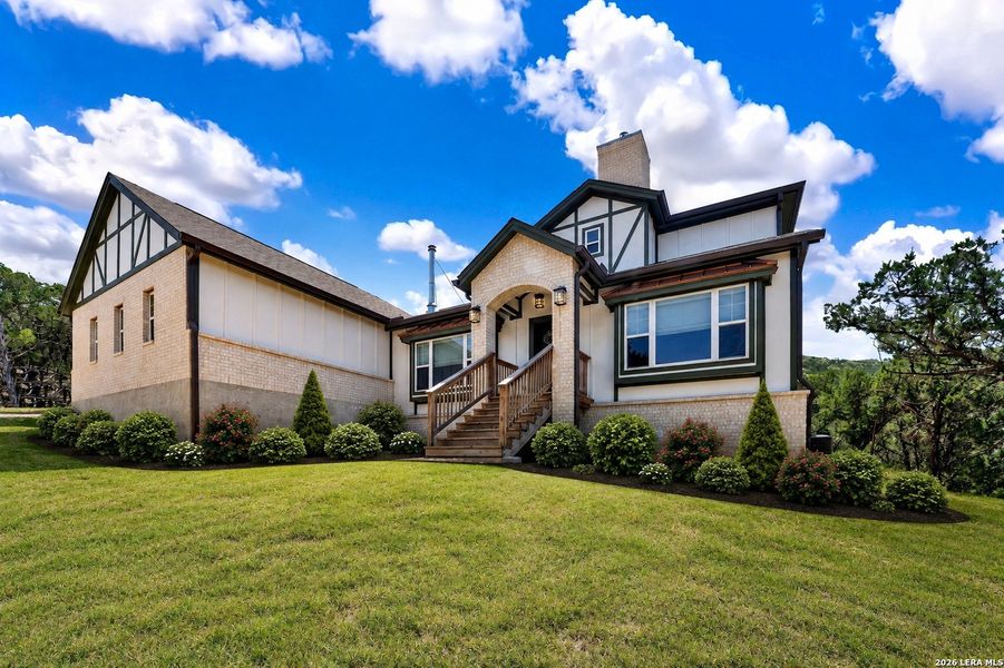 Front exterior of a new home in , Bandera, TX, highlighting curb appeal (Image 22).