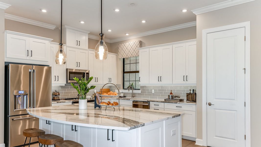 Furnished interior view inside a new home in Esplanade by the Islands Coach Homes, Naples (Image 3). Furnished interior view inside a new home in Esplanade by the Islands Coach Homes, Naples (Image 3).