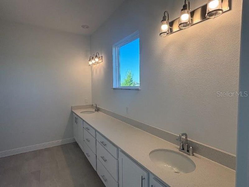 Furnished interior view inside a new home in Ardisia Park Estate, New Smyrna Beach (Image 8).