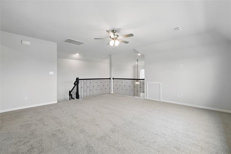 Empty room featuring a ceiling fan, carpet floors, and baseboards Empty room featuring a ceiling fan, carpet floors, and baseboards