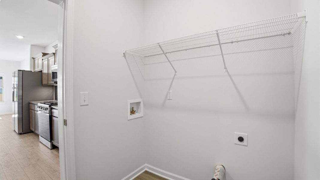 laundry room located between kitchen and garage laundry room located between kitchen and garage