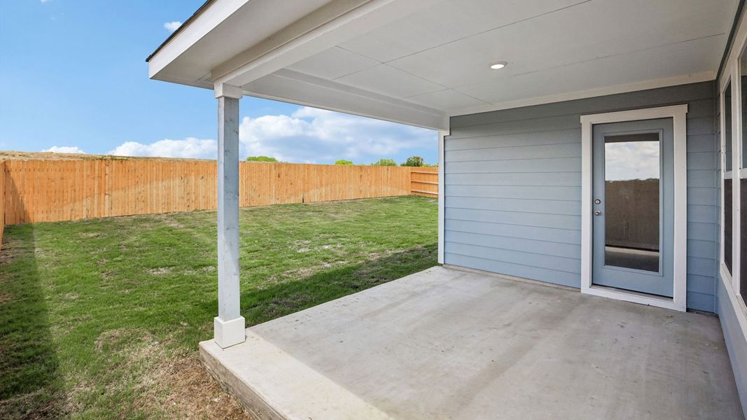 Exterior details and patio area of a home in Prairie Lakes, Buda (Image 26).